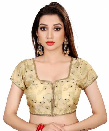 Grab This Beautiful Readymade Blouse To Pair Up With Your Plain Or Printed Saree Or Lehenga. This Pretty Cream Colored Blouse IS Fabricated On Cotton Silk And Available In All Regular Sizes. 