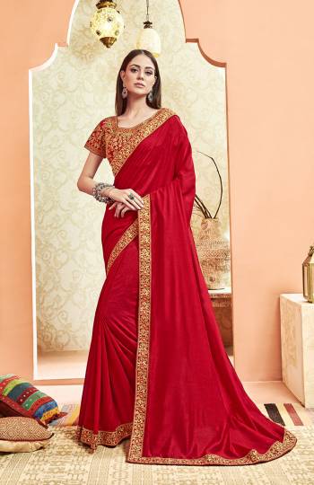 Here Is A Rich And Elegant Looking Designer Saree In Red Color. This Pretty Elegant Silk Based Saree Is Plain With Embroidered Border And Heavy Embroidered Blouse.  Its Rich Color And Elegant Pattern Will Earn You Lots Of Compliments From Onlookers. 