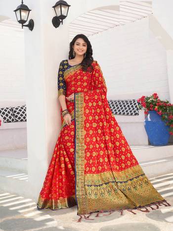 For A Proper Traditional Wear, Grab This Designer Silk Based Saree In Red Color Paired With Contrasting Navy Blue Colored Blouse. This Saree Is Fabricated On Nylon Crepe Silk Paired With Art Silk Fabricated Blouse. It Is Beautified With Heavy Weave All Over. 