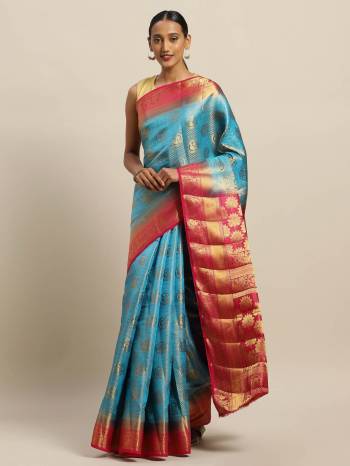 Celebrate This Festive Season Wearing This Pretty Silk Based Saree In Blue Paired With Contrasting Navy Blue Colored Blouse. This Saree And Blouse Are Fabricated On Art Silk Beautified with Weave All Over. 