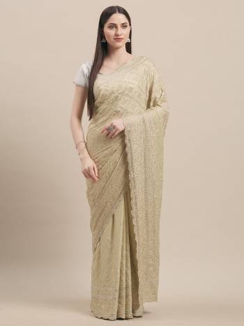 You Will Definitely Earn Lots Of Compliments Wearing This Heavy Designer Saree In Pastel Blue Color Paired With Silver Colored Blouse. This Pretty Saree IS Georgette Based Beautified With Heavy Detailed Tone To Tone Embroidery All Over Paired With Art Silk Fabricated Blouse. 