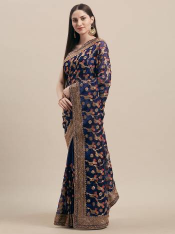 Get Ready For The Upcoming Wedding Season With This Heavy Embroidred Designer Saree In Navy Blue Color. This Saree Is Fabricated On Georgette Paired With Art Silk Fabricated Blouse. By This Pretty Saree Now.