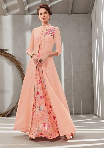 Grab This Beautiful Designer Readymade Gown In Two Layer Consist Of A Printed Inner And Plain Jacket In Peach Color. Its Embroidered Jacket Is Fabricated On Poly Organdy Paired With Digital Printed Rayon Cotton Inner. Buy This Readymade Gown Now.