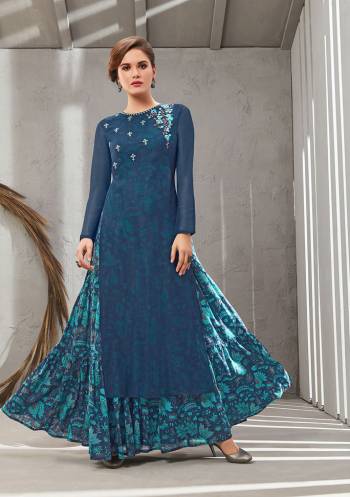 Grab This Beautiful Designer Readymade Gown In Two Layer Consist Of A Printed Inner And Plain Jacket In Blue Color. Its Embroidered Jacket Is Fabricated On Poly Organdy Paired With Digital Printed Rayon Cotton Inner. Buy This Readymade Gown Now.