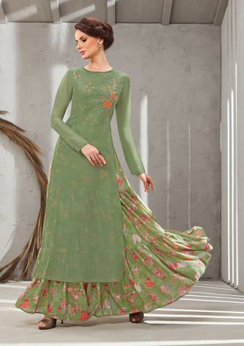 Grab This Beautiful Designer Readymade Gown In Two Layer Consist Of A Printed Inner And Plain Jacket In Olive Green Color. Its Embroidered Jacket Is Fabricated On Poly Organdy Paired With Digital Printed Rayon Cotton Inner. Buy This Readymade Gown Now.