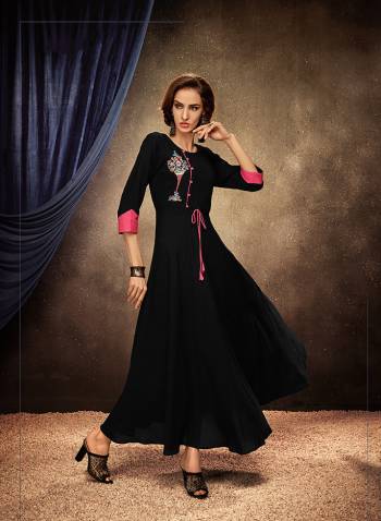 Add This Pretty Readymade Designer Gown To Your Wardrobe In Black Color. This Pretty Gown Is Fabricated On Rayon Beautified With Thread Embroidery. Its Fabric Is Soft Towards Skin, Light Weight And Easy To Carry All Day Long. 