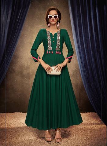 Add This Pretty Readymade Designer Gown To Your Wardrobe In Green Color. This Pretty Gown Is Fabricated On Rayon Beautified With Thread Embroidery. Its Fabric Is Soft Towards Skin, Light Weight And Easy To Carry All Day Long. 