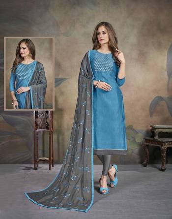 Here Is A Pretty Simple Dress Material For Your Semi-Casual Wear In Blue Color Paired With Grey colored bottom And Dupatta. Its Top Is Fabricated On Soft Cotton Paired With Cotton Bottom and Chiffon Fabricated Dupatta. 