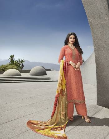 Rich And Elegant Looking Designer Straight Suit Is Here In Peach Color. Its Pretty Top Is Crepe Based Paired With Santoon Bottom And Chiffon Dupatta.It Is Beautified With Prints And Attractive Embroidery. 