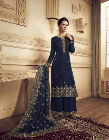 You Will Definitely Earn Lots Of Compliments Wearing This Designer Straight Suit With Heavy Dupatta Concept. This Lovely Navy Blue Colored Suit Is Silk Based Beautified with Weaving And Hand Work. Its Rich Color And Fabric Gives An Attractive Look To Your Pers