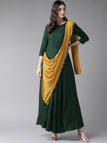 Look Pretty In This Readymade Designer Indo-Western Dress In Dark Green Color. This Pretty Dress Is Fabricated On Rayon Attached With A Pretty Musturd Yellow Dupatta With Lace Border. Its Fabric IS Soft Towards Skin And Ensures Superb Comfort All Day Long. 