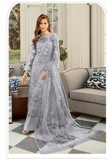 Here Is A Very Beautiful Designer Pakistani Suit In All Over Grey Color. Its Heavy Embroidered Top And Dupatta Are Fabricated On Net Paired With Santoon Bottom. It Is Light Weight And Easy To Carry Throughout The Gala. 