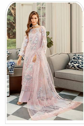 Here Is A Very Beautiful Designer Pakistani Suit In All Over Baby Pink Color. Its Heavy Embroidered Top And Dupatta Are Fabricated On Net Paired With Santoon Bottom. It Is Light Weight And Easy To Carry Throughout The Gala. 