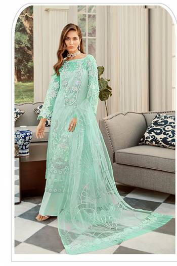 Here Is A Very Beautiful Designer Pakistani Suit In All Over Sea Green Color. Its Heavy Embroidered Top And Dupatta Are Fabricated On Net Paired With Santoon Bottom. It Is Light Weight And Easy To Carry Throughout The Gala. 