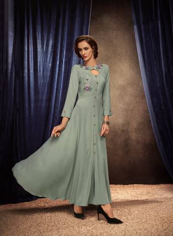 Flaunt Your Rich And Elegant Taste Wearing This Designer Readymade Long Gown In Grey Color. This  Pretty Gown Is Fabricated On Rayon Beautified With Thread Work. Its Fabric Is Soft Towards Skin And Easy To Carry All Day Long. 