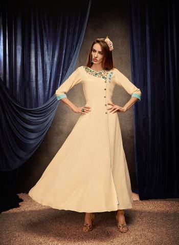 Flaunt Your Rich And Elegant Taste Wearing This Designer Readymade Long Gown In Cream Color. This  Pretty Gown Is Fabricated On Rayon Beautified With Thread Work. Its Fabric Is Soft Towards Skin And Easy To Carry All Day Long. 