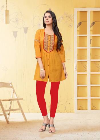 Here Is A Very Pretty Readymade Short Kurti In Yellow Color Fabricated On Rayon Flex. It Is Beautified With Thread Work And Available In All Regular Sizes. 