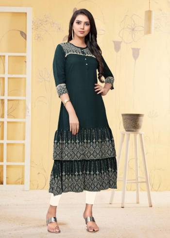 For Your Semi-Casual Wear, Grab This Readymade Kurti In Teal Blue Color Fabricated On Rayon Flex. It Is Beautified With DetailedThread Work. You Can Pair This Up With Same Or Contrasting Colored Bottom. Buy Now.