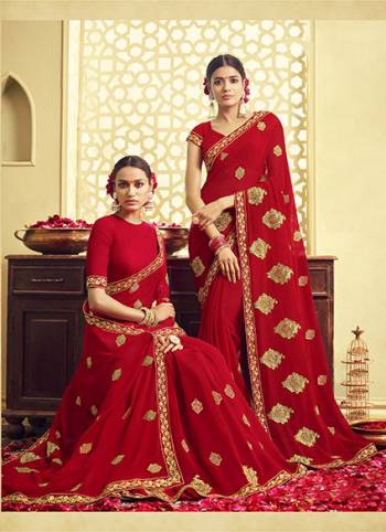 Adorn The Pretty Angelic Look Wearing This Designer Saree In Red Color Paired With Red Colored Blouse. This Saree And Blouse Are Fabricated On Georgette Beautified With Jari Embroidery. Buy Now.