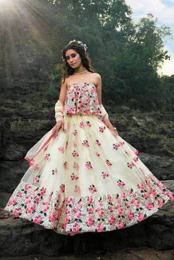 You Will Definitely Earn Lots Of Compliments Wearing This Heavy Designer Lehenga Choli In Off-White And multi Color. Its Blouse , Lehenga  And Dupatta Are Fabricated On Net Beautified With Colorful Embroidery. 