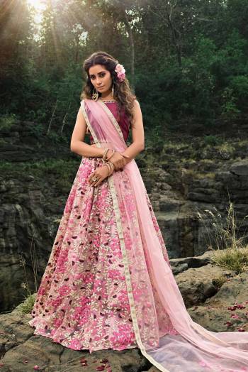 Catch All The Limelight At The Next Wedding You Attend Wearing This Heavy Designer Lehenga Choli In Magenta Pink Colored Blouse Paired With Baby Pink Colored Lehenga And Dupatta. This Pretty Lehenga Is Net Based Beautified With Attractive Embroidery. Buy Now.