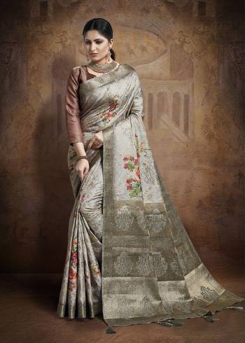 Celebrate This Festive Season In This Very Beautiful And Attractive Looking Designer Saree In Grey Color Paired With Brown Colored Blouse. This Saree and Blouse Are Fabricated On Jacquard Silk Beautified With Weave All Over. Buy This Saree Now.