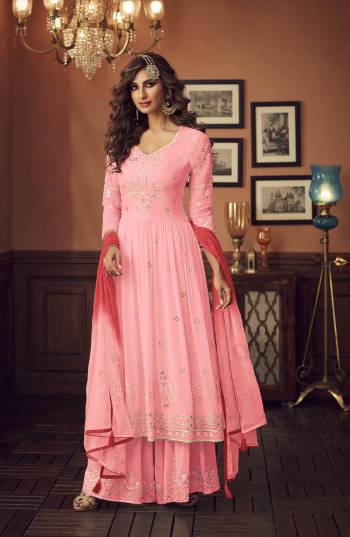 Grab This Very Pretty Designer Pakistani Sharar Suit In Pink Color. Its Embroidered Top And Bottom Are Fabricated On Georgette Paired With Chiffon Fabricated Dupatta. All Its Fabric Are Light Weight And Easy To Carry Throughout The Gala. 