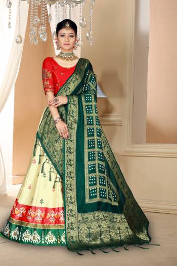 Go Colorful Wearing This Designer Silk Based Lehenga In Red, Cream And Dark Green Color. Its Pretty Blouse And Lehenga Are Fabricated On Satin Silk Paired With Bandhani Silk Dupatta. Its Fabric Is Durable, Light Weight And Easy To Carry Throughout The Gala. 