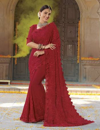 Adorn The Pretty Angelic Look In This Beautiful Red Colored Designer Saree. This Saree Is Fabricated On Chiffon Paired With Fancy Net Blouse. It Is Beautified With Tone To Tone Embroidery Giving An Elegant Subtle Look. 