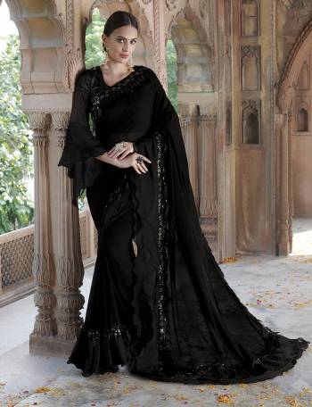 For A Bold And Beautiful Look , Grab This Very Pretty Designer Saree In Black Color Paired With Black Colored Blouse. This Saree IS Georgette Based Paired With Imported Fabricated Blouse. Buy This Elegant Looking Saree Now.