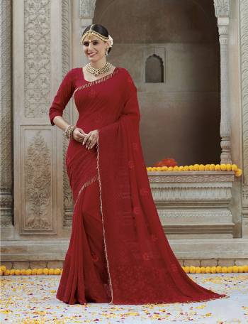 Adorn The Pretty Angelic Look In This Beautiful Red Colored Designer Saree. This Saree Is Fabricated On Chiffon Paired With Art Silk Blouse. It Is Beautified With Tone To Tone Embroidery Giving An Elegant Subtle Look. 