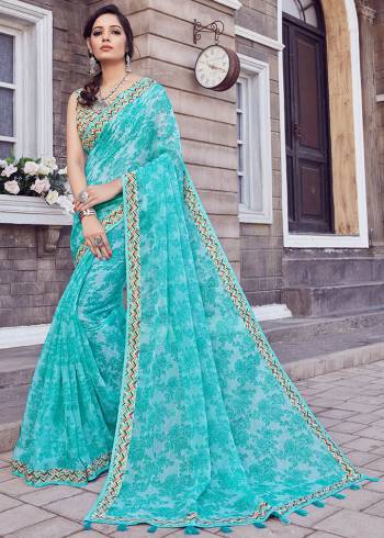 Grab This Beautiful Designer Saree In Turquoise Blue Color. This Pretty Printed Saree Is Cotton Silk Based Paired With Art Silk Fabricated Blouse. Buy Now.