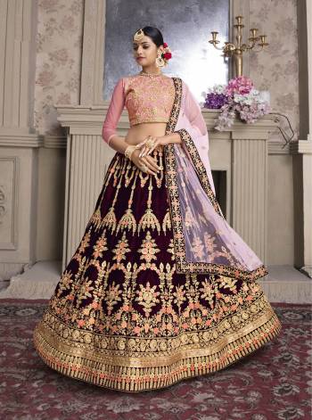 Get Ready For The Upcoming Wedding Season Wearing This Heavy Designer Lehenga Choli In Pink Colored Blouse Paired With Maroon Colored Lehenga Baby Pink Colored Dupatta. Its Blouse Is Fabricated On Art Silk Paired With Velvet Lehenga And Net Fabricated Dupatta. 