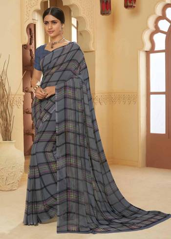 Add This Lovely Saree To Your Wardrobe Fabricated On Georgette. It Is Beautified With Prints All Over Gives A Pretty Simple and Elegant Look To Your Personality. 