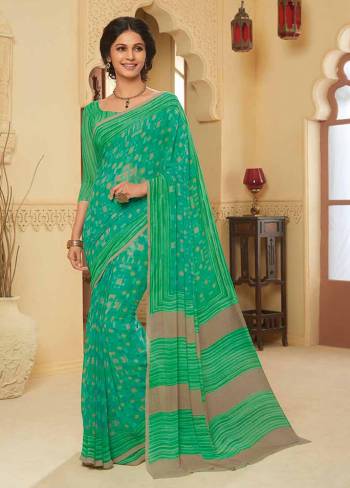 Here Is A Pretty Saree For Your Casual Or Semi-Casual Wear. This Printed Saree And Blouse Are Fabricated On Georgette WhichIs Light Weight, Durable And Easy To Carry All Day Long. Buy Now.