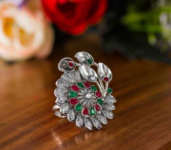 Here Is A Pretty Traditional Looking Ring In Silver Color In Oxidize Material. This Pretty Ring Is Beautified With Multi Color Stone Work And You Can Pair This Up With Any Colored Traditional Attire. Buy Now.