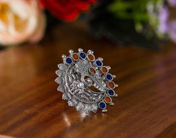 Here Is A Pretty Traditional Looking Ring In Silver Color In Oxidize Material. This Pretty Ring Is Beautified With Multi Color Stone Work And You Can Pair This Up With Any Colored Traditional Attire. Buy Now.