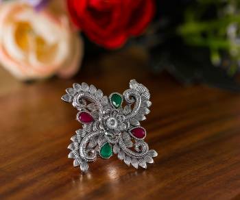 Here Is A Pretty Traditional Looking Ring In Silver Color In Oxidize Material. This Pretty Ring Is Beautified With Multi Color Stone Work And You Can Pair This Up With Any Colored Traditional Attire. Buy Now.