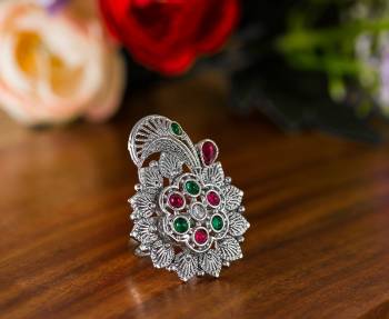 Here Is A Pretty Traditional Looking Ring In Silver Color In Oxidize Material. This Pretty Ring Is Beautified With Multi Color Stone Work And You Can Pair This Up With Any Colored Traditional Attire. Buy Now.