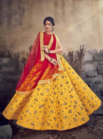 Celebrate This Festive And Wedding Season Wearing This Designer Lehenga Choli In Red Colored Blouse Paired With Contrasting Yellow Colored Lehenga And Red Colored Dupatta. Its Blouse and Dupatta Are Net Based Paired With Silk Based Lehenga. Buy Now. 