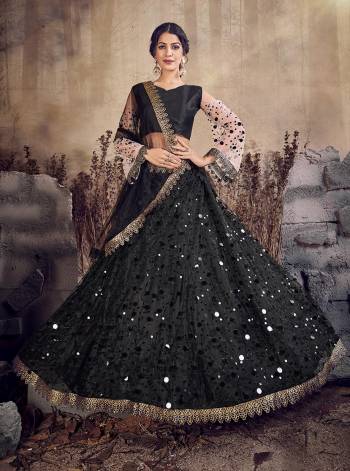 For A Bold And Beautiful This Designer Lehenga Choli In All Over Black Color. This Lehenga , Choli And Dupatta Are Net Based Beautified With Pretty Attractive Embroidery. 