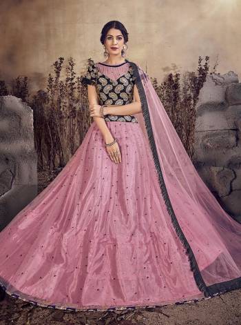 Celebrate This Festive And Wedding Season Wearing This Designer Lehenga Choli In Pink And Black Color. Its Lehenga and Dupatta Are Net Based Paired With Silk Based Blouse. Buy Now. 