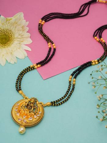 Grab This Double Chained Traditional Patterned Magalsutra Which Has An Attatched Pendant. This Mangalsutra Can Be Paired With Any Colored Traditional Attire And Suitable For Occasion Wear. Buy Now