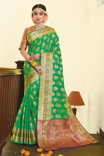 For A Proper Traditional Look, Grab This Designer Silk Based Saree In Green Color Paired With Contrasting Purple Colored Blouse. This Saree And Blouse Are Fabricated On Art Silk Beautified With Weave. 