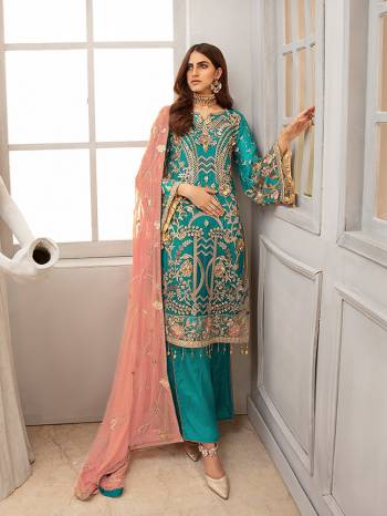 Here Is A Very Pretty Designer Straight Suit In Blue Color Paired with Contrasting Peach Colored Dupatta. Its Heavy Embroidered Top And Dupatta Are Georgette Based Paired With Santoon Fabricated Bottom. Buy This Party Wear Suit Now.