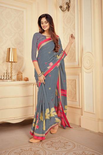 Flaunt Your Rich And Elegant Taste Wearing This Pretty Grey colored Saree. This Saree And Blouse Are Satin Silk Based Beautified With Prints. Buy This Saree Now.