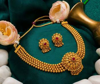 Give An Enhanced Look To Your Personality By Pairing Up This Beautiful Necklace Set With Your Ethnic Attire. This Pretty Set Is In Golden Color Beautified With Stone Work. Buy Now.