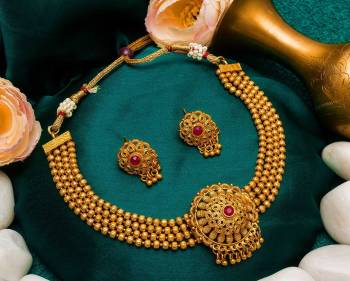 Give An Enhanced Look To Your Personality By Pairing Up This Beautiful Necklace Set With Your Ethnic Attire. This Pretty Set Is In Golden Color Beautified With Stone Work. Buy Now.