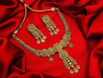 Give An Enhanced Look To Your Personality By Pairing Up This Beautiful Necklace Set With Your Ethnic Attire. This Pretty Set Is In Golden Color Beautified With Stone Work. Buy Now.