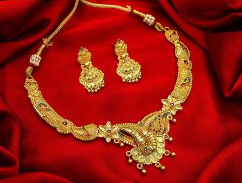 Give An Enhanced Look To Your Personality By Pairing Up This Beautiful Necklace Set With Your Ethnic Attire. This Pretty Set Is In Golden Color Beautified With Stone Work. Buy Now.